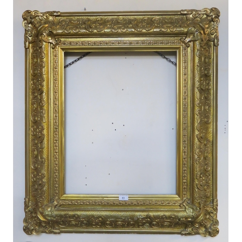 83 - A 19th century gilt gesso picture frame, 95cm high x 83cm wide and a pair of smaller gilt gesso fram... 