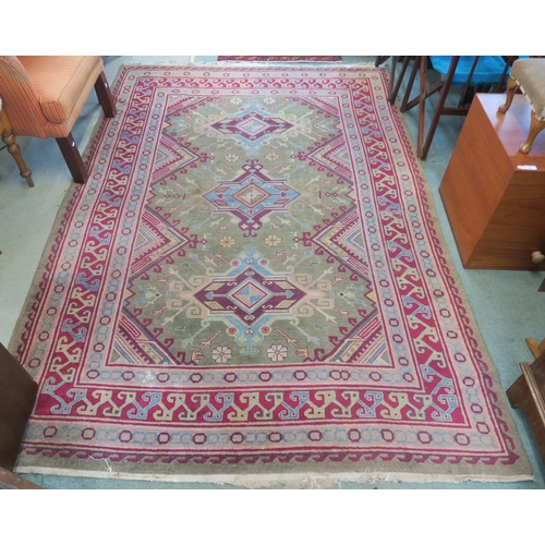 91 - A green ground Kilim rug with three geometric medallions and multicoloured borders, 271cm long x 187... 