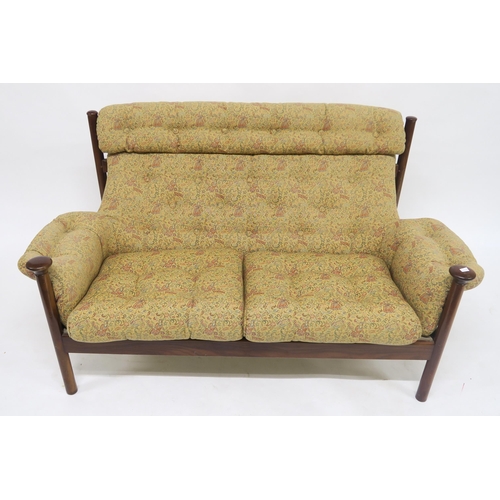 123 - A mid 20th century teak framed Guy Rogers Santa Fe three piece suite with floral buttoned upholstery... 