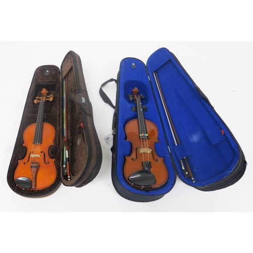 429 - A Chinese made Stentor student violin 28 cm with bow and case together with another including bow an... 