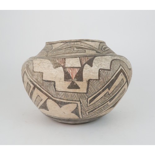 336 - A ZUNI PUEBLO POLYCHROME OLLA (WATER JAR)the inner rim painted black, the top section painted with h... 