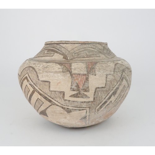 336 - A ZUNI PUEBLO POLYCHROME OLLA (WATER JAR)the inner rim painted black, the top section painted with h... 