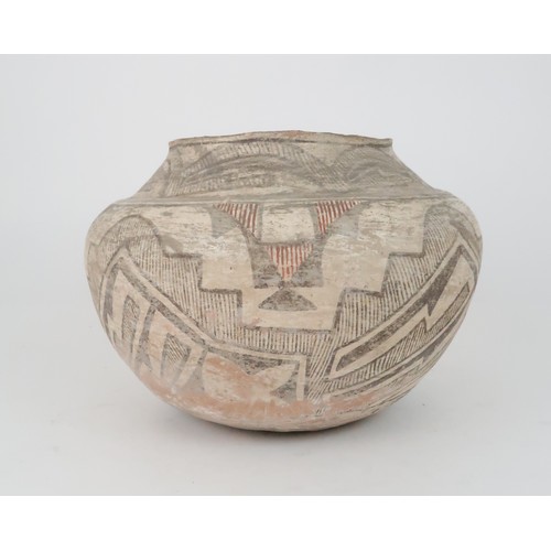 336 - A ZUNI PUEBLO POLYCHROME OLLA (WATER JAR)the inner rim painted black, the top section painted with h... 