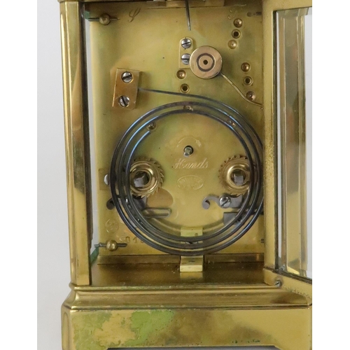 151 - A FRENCH BRASS REPEATER CARRIAGE CLOCKwith silvered chased dial and roman numerals, the movement mar... 