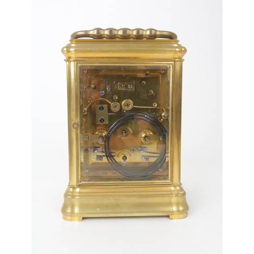 152 - A FRENCH BRASS CARRIAGE REPEATER/ALARM CLOCKwith gilt metal and white enamel dial with Roman numeral... 