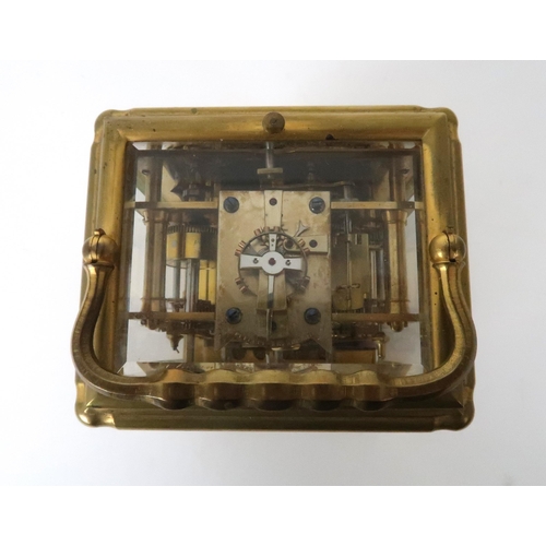 152 - A FRENCH BRASS CARRIAGE REPEATER/ALARM CLOCKwith gilt metal and white enamel dial with Roman numeral... 