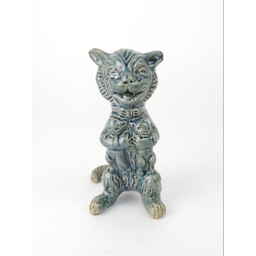 159 - A DUNMORE POTTERY MODEL OF A CATholding kittens, 11.5cm high