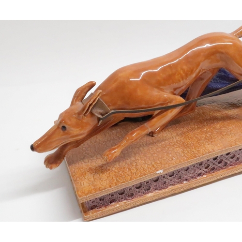 168 - CRAIG MITCHELL - AERODYNAMIC DOG WALKERceramic sculpture, 65.5cm longCraig Mitchell is an Edinburgh ... 