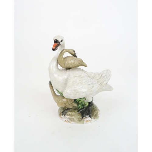 183 - A MEISSEN STYLE GROUP OF A SWAN AND CYGNETSincised mark to base