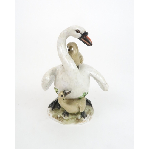 183 - A MEISSEN STYLE GROUP OF A SWAN AND CYGNETSincised mark to base