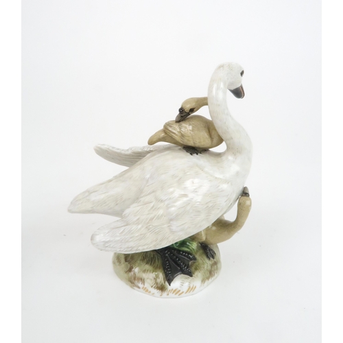 183 - A MEISSEN STYLE GROUP OF A SWAN AND CYGNETSincised mark to base