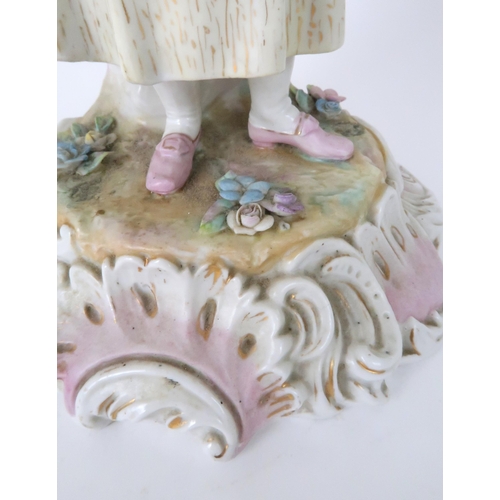 194 - A PAIR OF MEISSEN STYLE CANDELABRASeach with a figure below floral encrusted candle arms, 52cm high... 