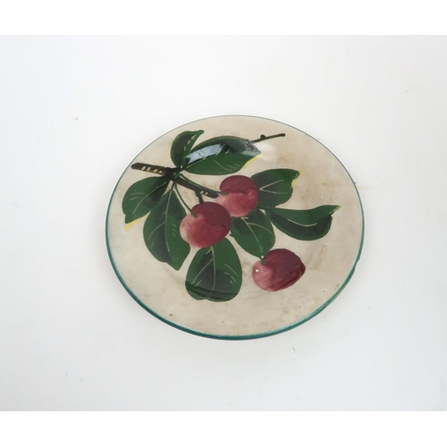 196 - A WEMYSS FOOTED BOWLpainted with apples within a green rim, impressed mark to base, 14cm high, toget... 