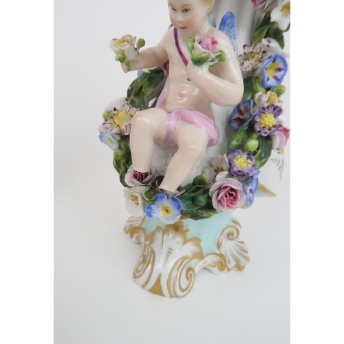 197 - A PAIR OF MEISSEN URNS AND COVERSeach with painted and encrusted flowers and cherubs, upon scrolling... 