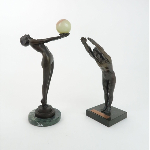 AN ART DECO STYLE BRONZEmodelled as a naked girl holding an onyx