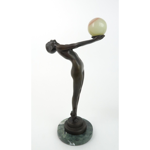 200 - AN ART DECO STYLE BRONZEmodelled as a naked girl holding an onyx ball, 32cm high, together with a sp... 