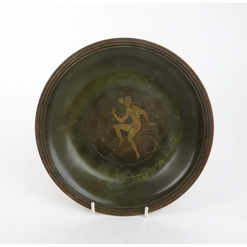 203 - A DANISH ART DECO VERDIGRIS-PATINATED BRONZE PLATEdecorated with a female figure and large fish, mar... 