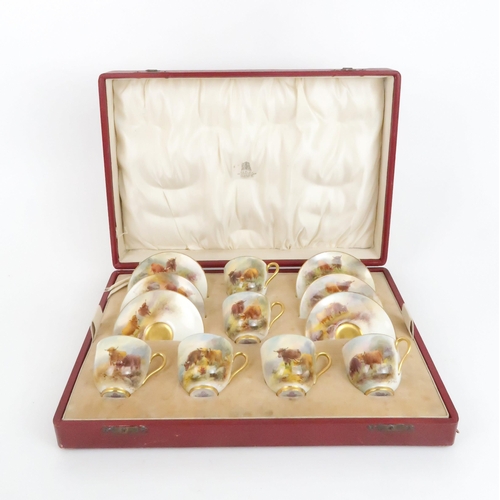 215 - A ROYAL WORCESTER PORCELAIN COFFEE SERVICE BY HARRY STINTONcomprising six demitasse cups and saucers... 