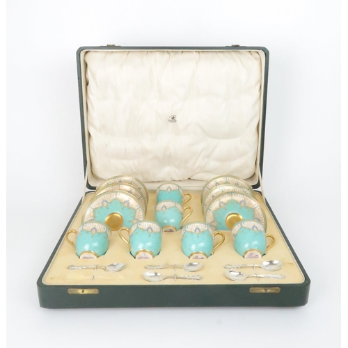 217 - A 1930's BOXED ROYAL WORCESTER COFFEE SETthe demitasse cups and saucers with turquoise and gilt deco... 