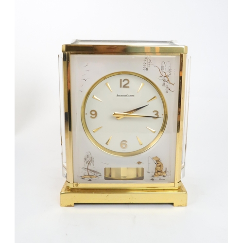 218 - A JAEGER LE COULTRE MARINA MODEL ATMOS CLOCKthe white dial within a flexi-glass and brass bound case... 