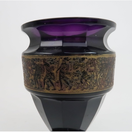 222 - A MOSER KARLSBAD VASEthe amethyst glass with gilded panel of warriors, signed to base, 15.5cm high... 