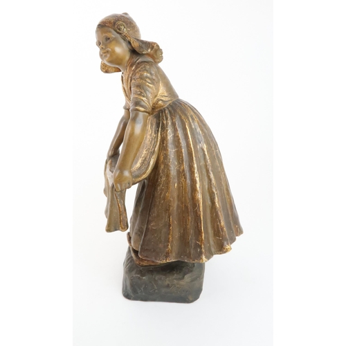 230 - A GOLDSCHEIDER GILDED TERRACOTTA FIGURE OF A DUTCH GIRL, impressed 2995, 38cm high