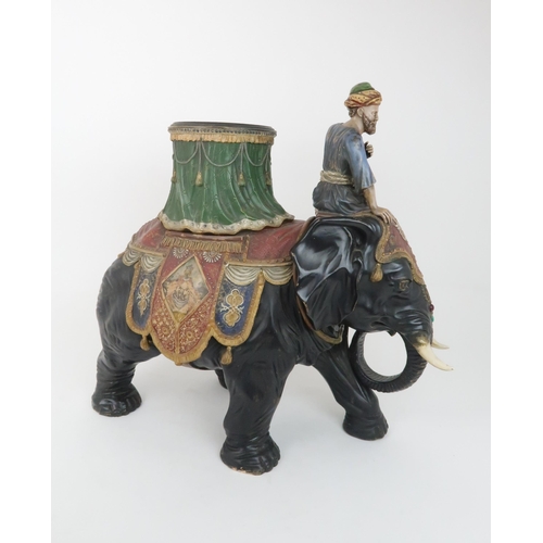 233 - A LARGE CERAMIC FERDINAND GERBING ELEPHANT AND RIDER PLANTERpainted in colours and with paste gem de... 