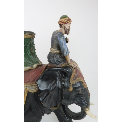 233 - A LARGE CERAMIC FERDINAND GERBING ELEPHANT AND RIDER PLANTERpainted in colours and with paste gem de... 