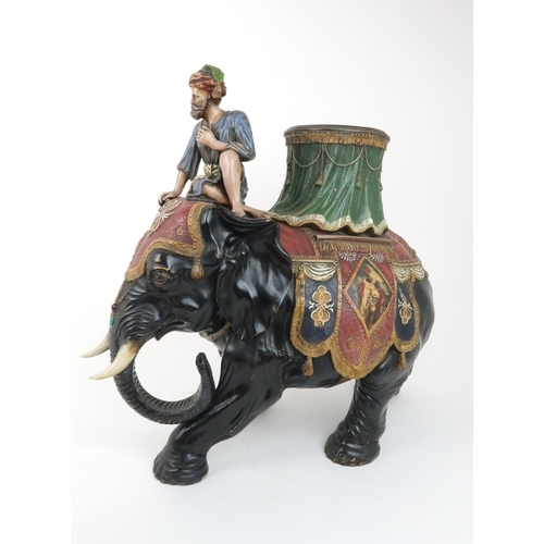 233 - A LARGE CERAMIC FERDINAND GERBING ELEPHANT AND RIDER PLANTERpainted in colours and with paste gem de... 