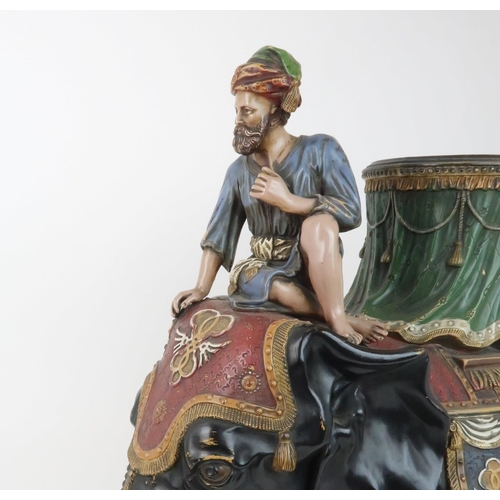 233 - A LARGE CERAMIC FERDINAND GERBING ELEPHANT AND RIDER PLANTERpainted in colours and with paste gem de... 