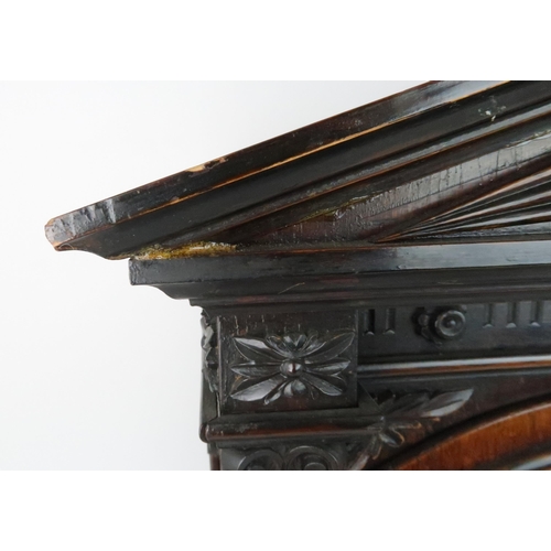 236 - A VICTORIAN CARVED OAK CASED CHIMING BRACKET CLOCKthe arched brass dial with slow/fast, chime/silent... 