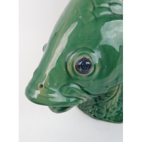 240 - A LARGE GREEN GLAZED POTTERY MODEL OF A FISH50cm high