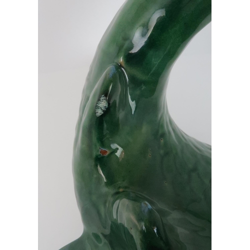 240 - A LARGE GREEN GLAZED POTTERY MODEL OF A FISH50cm high