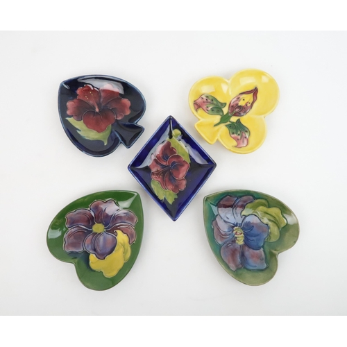 301 - A SET OF MOORCROFT BRIDGE DISHESin the form of Hearts/Diamonds/Spades/Clubs, Walter Moorcroft design... 