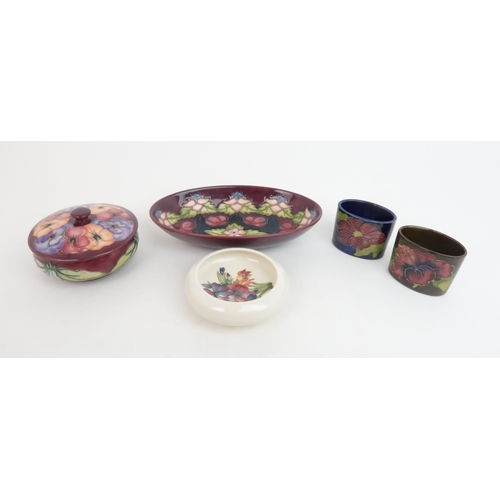 312 - A MOORCROFT SPECIAL EDITION MORELLO CHERRY BOWL1995, No. 930, a Pansy trinket pot and cover, second,... 