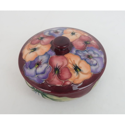 312 - A MOORCROFT SPECIAL EDITION MORELLO CHERRY BOWL1995, No. 930, a Pansy trinket pot and cover, second,... 