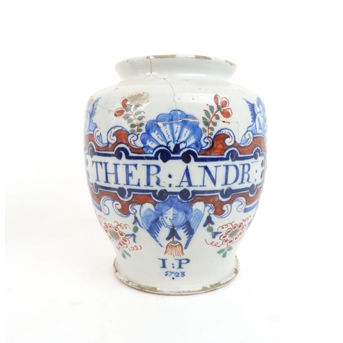 318 - AN ENGLISH DELFT DATED POLYCHROME DRUG-JARof typical shape, painted in blue, green and iron-red, nam...