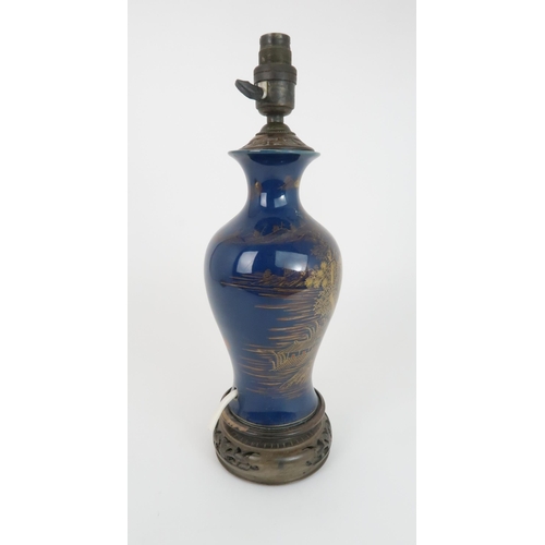 409 - A CHINESE POWDER BLUE BALUSTER VASEpainted in gilt with a river landscape, converted to a lamp, wood... 