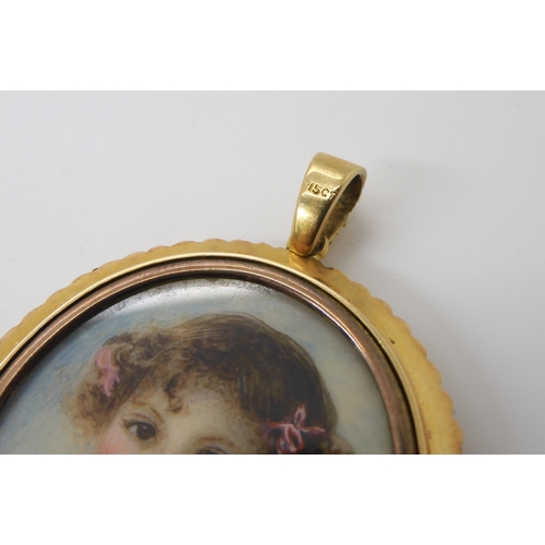 762 - A DOUBLE SIDED PORTRAIT MINIATURE LOCKETstamped 15ct to the bail, the portrait of a lady surrounded ... 