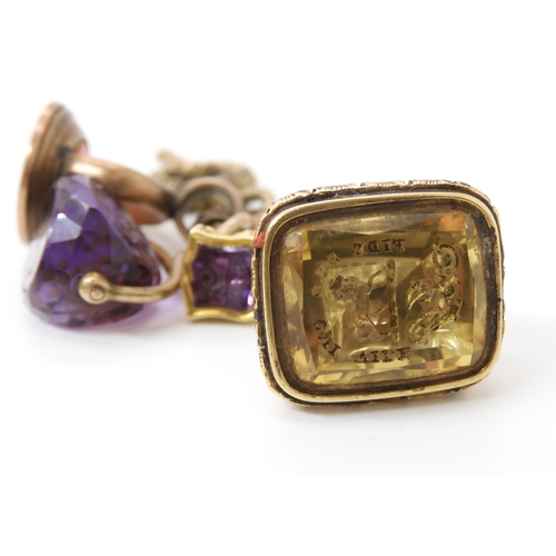 764 - A COLLECTION OF SEALSa yellow metal mounted amethyst triple faced seal, engraved with a large dog an... 