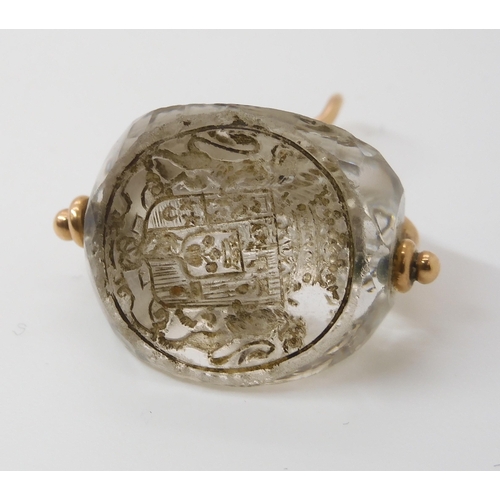 767 - AN INTAGLIO CARVED SWIVEL SEALthe three sided rock crystal carved with a motto in French, 'Ce Qui pe... 