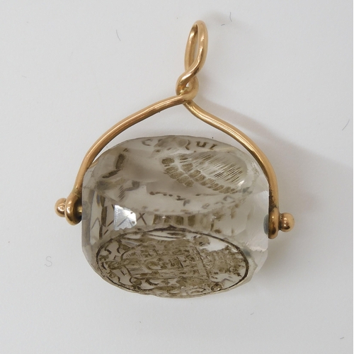 767 - AN INTAGLIO CARVED SWIVEL SEALthe three sided rock crystal carved with a motto in French, 'Ce Qui pe... 