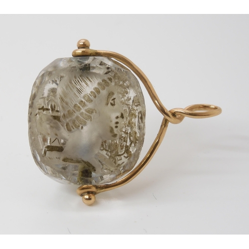 767 - AN INTAGLIO CARVED SWIVEL SEALthe three sided rock crystal carved with a motto in French, 'Ce Qui pe... 