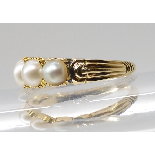 768 - A BRIGHT YELLOW METAL PEARL RINGthe five half pearls are in cut back settings with reeded shoulders,... 