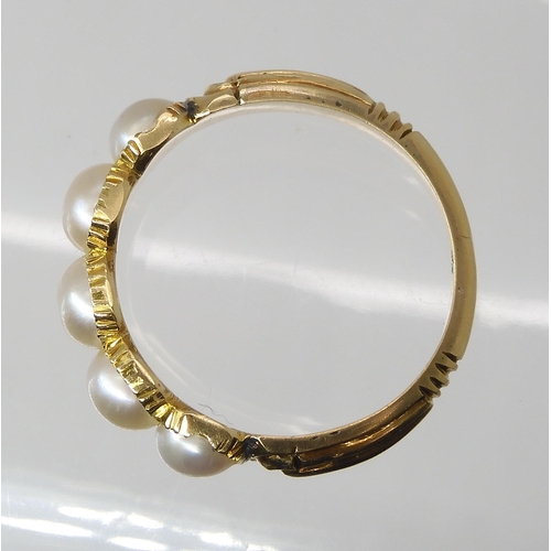 768 - A BRIGHT YELLOW METAL PEARL RINGthe five half pearls are in cut back settings with reeded shoulders,... 