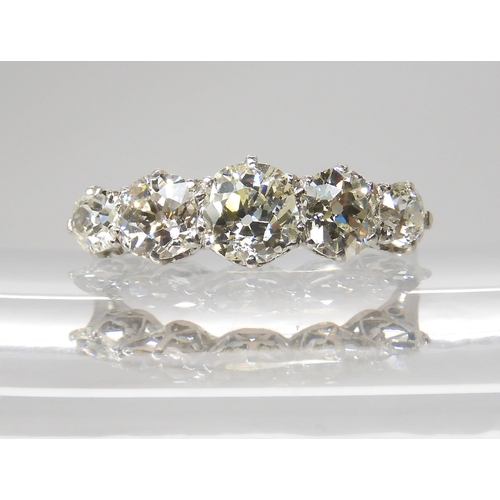 774 - A FIVE STONE DIAMOND RINGmounted in white metal with a finely made gallery, the five diamonds combin... 