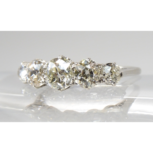 774 - A FIVE STONE DIAMOND RINGmounted in white metal with a finely made gallery, the five diamonds combin... 