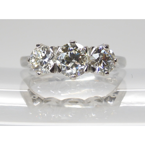 776 - A PLATINUM THREE STONE DIAMOND RINGset with estimated approx 1.90cts of old cut diamonds combined. F... 