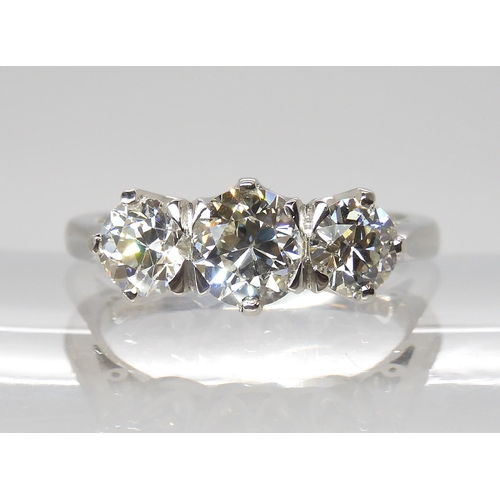 776 - A PLATINUM THREE STONE DIAMOND RINGset with estimated approx 1.90cts of old cut diamonds combined. F... 