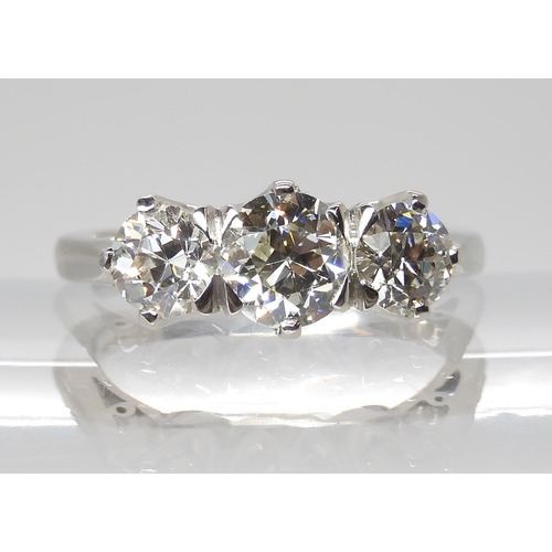 776 - A PLATINUM THREE STONE DIAMOND RINGset with estimated approx 1.90cts of old cut diamonds combined. F... 